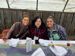 Three women sitting at a table