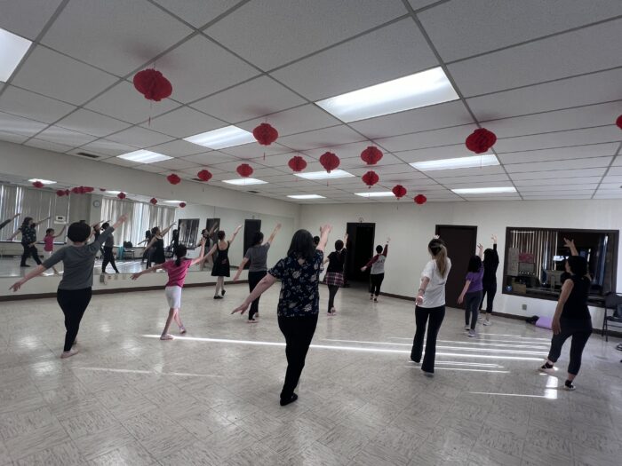 Group of women in a dance studio dancing.